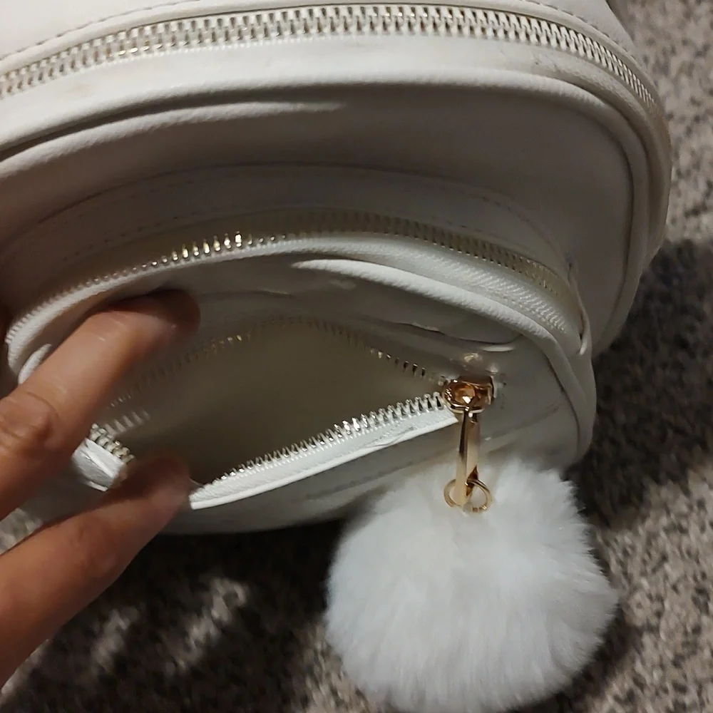 Girls white backpack with Pom